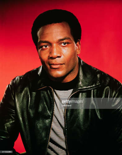 Young Jim Brown in leather jacket